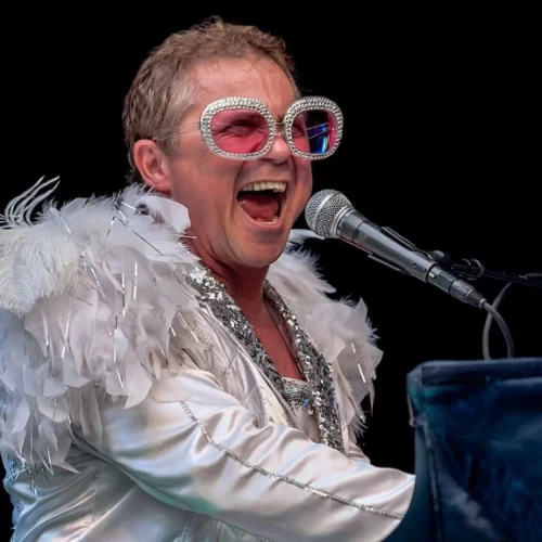Kenny Metcalf as Elton John